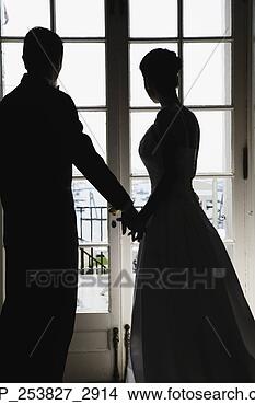 Stock Photo - silhouette of 
bride and groom 
in doorway,  sands 
point,  new york. 
fotosearch - search 
stock photos, 
pictures, images, 
and photo clipart