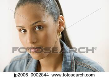 Stock Photo - studio shot of 
a female dominican 
teenager. fotosearch 
- search stock 
photos, pictures, 
images, and photo 
clipart