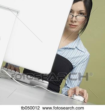 Stock Photo - studio shot of 
young woman with 
computer. fotosearch 
- search stock 
photos, pictures, 
images, and photo 
clipart