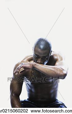 Stock Photo - sweaty african 
man sitting, edmonds, 
washington, united 
states. fotosearch 
- search stock 
photos, pictures, 
images, and photo 
clipart