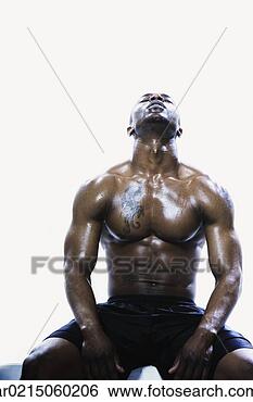 Stock Photo - sweaty african 
man sitting, edmonds, 
washington, united 
states. fotosearch 
- search stock 
photos, pictures, 
images, and photo 
clipart