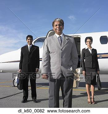 Stock Photo - three businesspeople 
standing next 
to airplane, perth, 
australia. fotosearch 
- search stock 
photos, pictures, 
images, and photo 
clipart