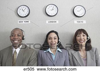 Stock Image - three businesspeople 
under world time 
zone clocks. fotosearch 
- search stock 
photos, pictures, 
images, and photo 
clipart