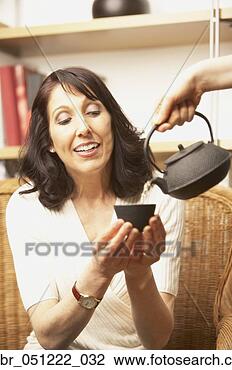 Stock Photo - woman being served 
tea, san rafael, 
california, united 
states. fotosearch 
- search stock 
photos, pictures, 
images, and photo 
clipart
