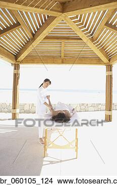 Stock Photo - woman getting 
massage outdoors 
at health spa, 
los cabos, mexico. 
fotosearch - search 
stock photos, 
pictures, images, 
and photo clipart