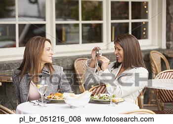 Stock Photo - woman having her 
photograph taken 
by other woman 
at lunch,  larkspur. 
fotosearch - search 
stock photos, 
pictures, images, 
and photo clipart