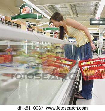 Picture - woman selecting 
frozen food at 
supermarket, perth, 
australia. fotosearch 
- search stock 
photos, pictures, 
images, and photo 
clipart