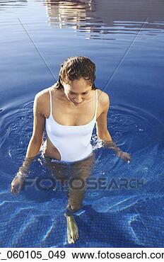 Stock Photograph - woman walking 
in pool. fotosearch 
- search stock 
photos, pictures, 
images, and photo 
clipart