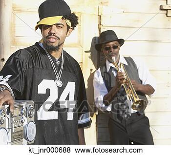 Stock Photo - young african 
man with boom 
box next to senior 
african man with. 
fotosearch - search 
stock photos, 
pictures, images, 
and photo clipart