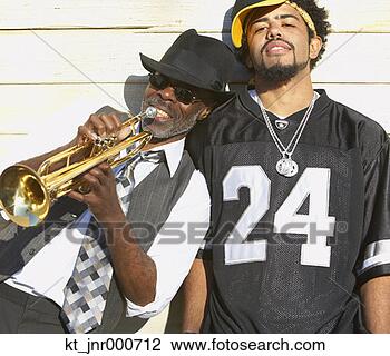 Stock Photo - young african 
man next to senior 
african man with 
trumpet,  oakland. 
fotosearch - search 
stock photos, 
pictures, images, 
and photo clipart