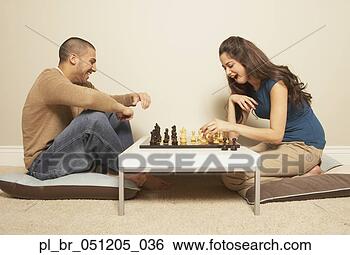 Stock Photo - young hispanic 
couple playing 
chess,  san rafael, 
 california. fotosearch 
- search stock 
photos, pictures, 
images, and photo 
clipart