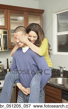 Picture - young hispanic 
man giving piggy 
back ride to young 
hispanic woman 
in. fotosearch 
- search stock 
photos, pictures, 
images, and photo 
clipart