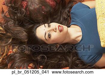 Stock Photography - young indian woman 
lying on the floor 
with hair fanned 
out,  san. fotosearch 
- search stock 
photos, pictures, 
images, and photo 
clipart