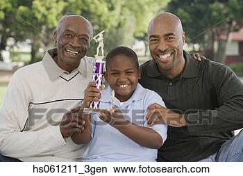 Stock Photo - african american 
family with trophy 
outdoors. fotosearch 
- search stock 
photos, pictures, 
images, and photo 
clipart