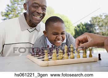 Stock Photo - african american 
grandfather and 
grandson playing 
chess. fotosearch 
- search stock 
photos, pictures, 
images, and photo 
clipart