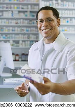 Stock Photo - african american 
male pharmacist 
smiling. fotosearch 
- search stock 
photos, pictures, 
images, and photo 
clipart