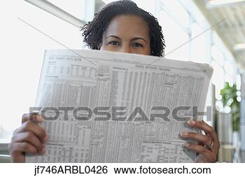 Stock Photo - african american 
woman reading 
newspaper. fotosearch 
- search stock 
photos, pictures, 
images, and photo 
clipart