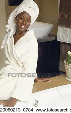 Stock Photo - african american 
woman in hotel 
bathroom wearing 
bathrobe. fotosearch 
- search stock 
photos, pictures, 
images, and photo 
clipart