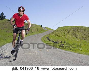 Stock Photo - asian man riding 
bicycle in countryside. 
fotosearch - search 
stock photos, 
pictures, images, 
and photo clipart