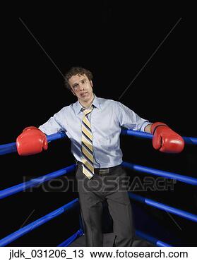 Stock Photo - businessman in 
corner of boxing 
ring with black 
eye. fotosearch 
- search stock 
photos, pictures, 
images, and photo 
clipart