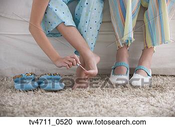 Stock Photography - close up of young 
girl painting 
her toenails. 
fotosearch - search 
stock photos, 
pictures, images, 
and photo clipart