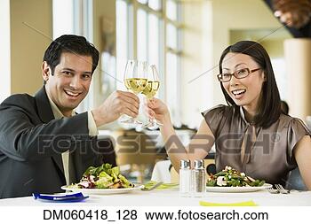Stock Photo - couple toasting 
at restaurant. 
fotosearch - search 
stock photos, 
pictures, images, 
and photo clipart