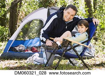 Stock Photo - father and daughter 
camping. fotosearch 
- search stock 
photos, pictures, 
images, and photo 
clipart