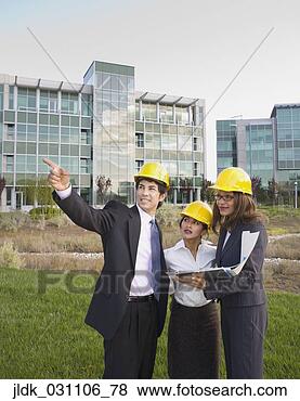 Stock Photo - group of businesspeople 
wearing hard hats. 
fotosearch - search 
stock photos, 
pictures, images, 
and photo clipart