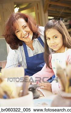 Stock Image - hispanic female 
art teacher with 
female student. 
fotosearch - search 
stock photos, 
pictures, images, 
and photo clipart