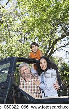 Stock Photo - hispanic grandparents 
with grandson 
in jeep. fotosearch 
- search stock 
photos, pictures, 
images, and photo 
clipart