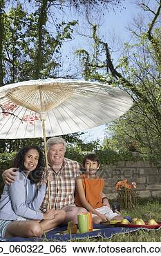 Stock Image - hispanic grandparents 
and grandson having 
a picnic. fotosearch 
- search stock 
photos, pictures, 
images, and photo 
clipart