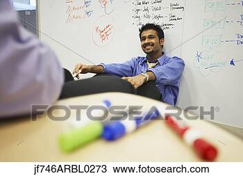 Stock Photo - indian businessman 
in front of white 
board in office. 
fotosearch - search 
stock photos, 
pictures, images, 
and photo clipart