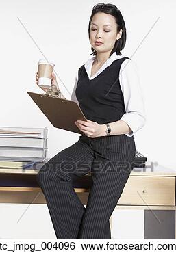 Stock Photo - studio shot of 
asian businesswoman 
with clipboard. 
fotosearch - search 
stock photos, 
pictures, images, 
and photo clipart