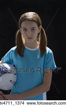 Stock Photo - studio shot of 
young girl with 
soccer ball. fotosearch 
- search stock 
photos, pictures, 
images, and photo 
clipart
