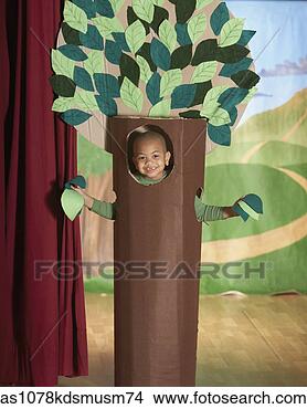Stock Photo - young african 
american boy in 
tree costume on 
stage. fotosearch 
- search stock 
photos, pictures, 
images, and photo 
clipart