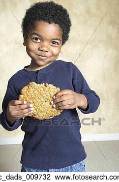 Stock Photo - young african 
american boy eating 
large cookie. 
fotosearch - search 
stock photos, 
pictures, images, 
and photo clipart