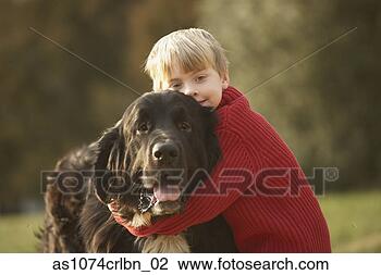 Stock Photo - young boy hugging 
dog outdoors. 
fotosearch - search 
stock photos, 
pictures, images, 
and photo clipart