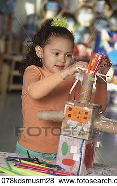 Stock Photo - young hispanic 
girl making art 
project. fotosearch 
- search stock 
photos, pictures, 
images, and photo 
clipart