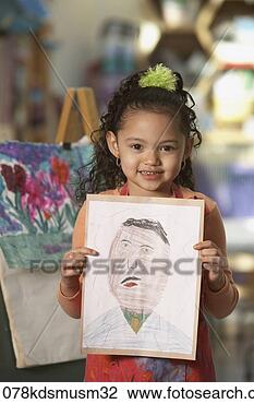Stock Photo - young hispanic 
girl holding artwork. 
fotosearch - search 
stock photos, 
pictures, images, 
and photo clipart