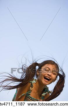 Picture - young hispanic 
girl laughing 
outdoors. fotosearch 
- search stock 
photos, pictures, 
images, and photo 
clipart