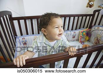 Stock Image - african baby in 
standing crib. 
fotosearch - search 
stock photos, 
pictures, images, 
and photo clipart