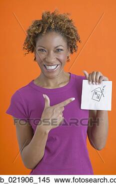 Stock Image - african woman 
smiling and pointing 
to house drawn 
on napkin. fotosearch 
- search stock 
photos, pictures, 
images, and photo 
clipart