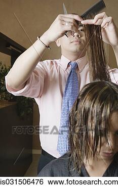 Stock Photo - asian male hairstylist 
cutting hair. 
fotosearch - search 
stock photos, 
pictures, images, 
and photo clipart