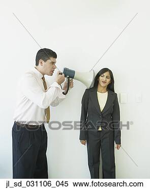Stock Image - businessman with 
megaphone yelling 
at businesswoman. 
fotosearch - search 
stock photos, 
pictures, images, 
and photo clipart