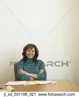 Stock Photography - businesswoman 
at conference 
table with paperwork. 
fotosearch - search 
stock photos, 
pictures, images, 
and photo clipart