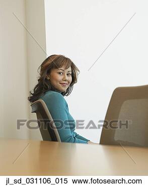 Stock Image - businesswoman 
sitting at conference 
table. fotosearch 
- search stock 
photos, pictures, 
images, and photo 
clipart