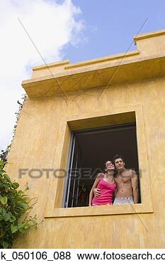Stock Photo - couple hugging 
in window. fotosearch 
- search stock 
photos, pictures, 
images, and photo 
clipart