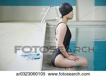 Stock Image - female asian swimmer 
with legs in pool. 
fotosearch - search 
stock photos, 
pictures, images, 
and photo clipart