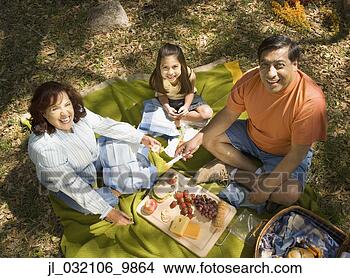 Stock Photo - grandparents and 
granddaughter 
having a picnic. 
fotosearch - search 
stock photos, 
pictures, images, 
and photo clipart