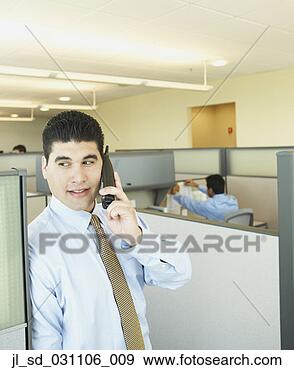 Stock Photograph - hispanic businessman 
using telephone. 
fotosearch - search 
stock photos, 
pictures, images, 
and photo clipart